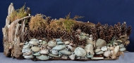 Driftwood art of riverside nature scene